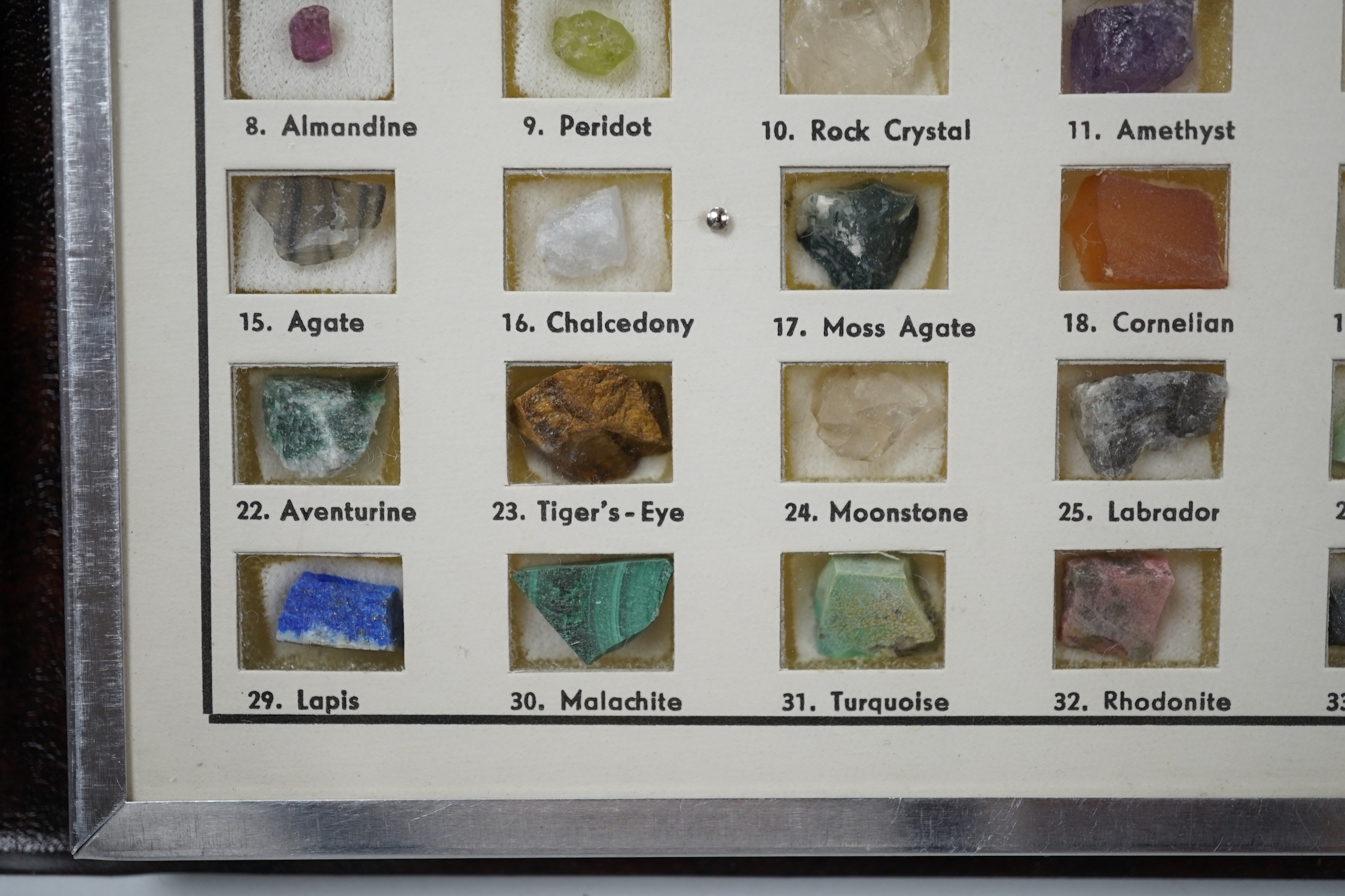 A small presentation booklet containing thirty five natural precious stones.